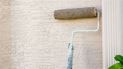 what happens if you paint stucco before it cures? how does this affect the durability of your home's exterior?